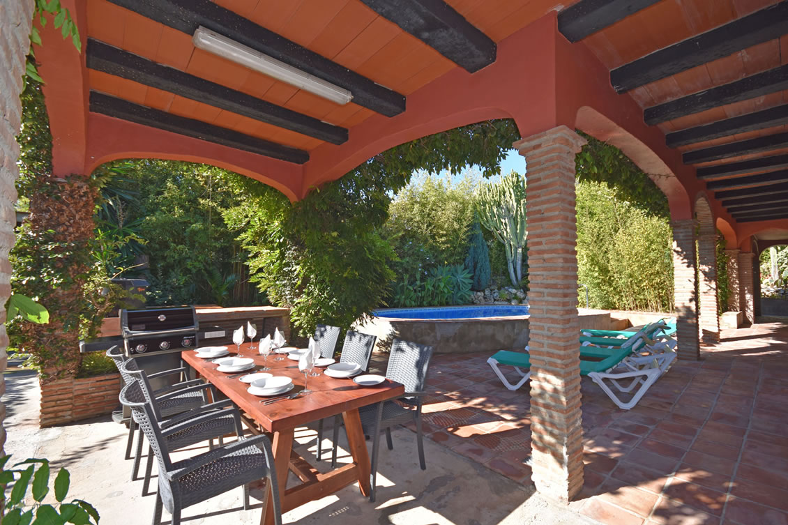 Covered Terraces flank the Swimming Pool